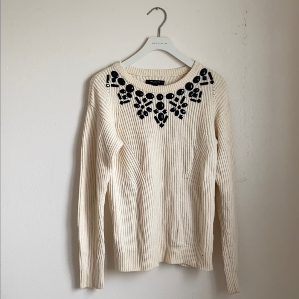 Cream sweater with black embellishments